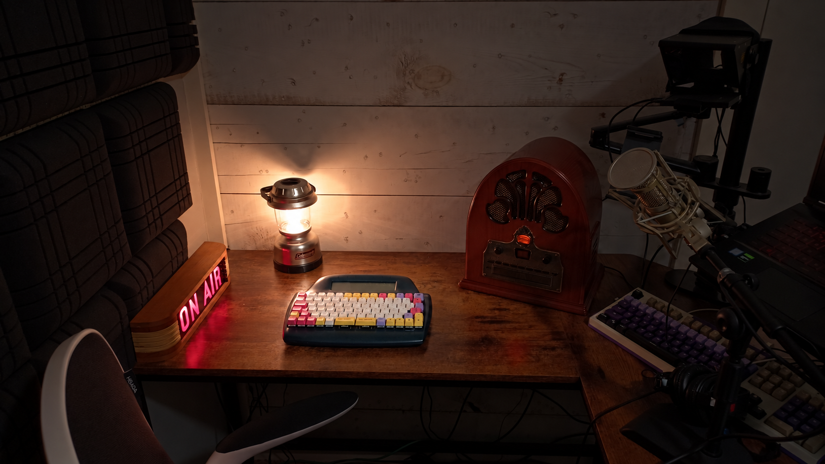 Jerry’s actual writing desk with his AlphaSmart, cathedral radio, silver Coleman lantern and glowing ON AIR sign